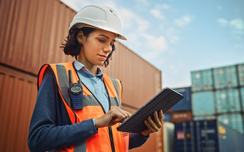 Worker-at-a-port-holding-a-tablet